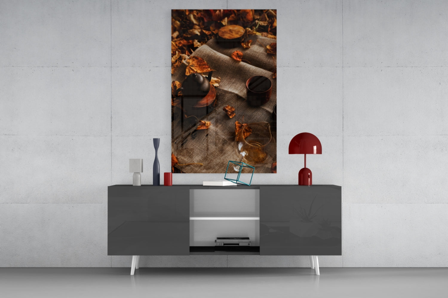 Autumn Picnic Glass Art displayed as wall art above a modern gray sideboard with decorative accessories.