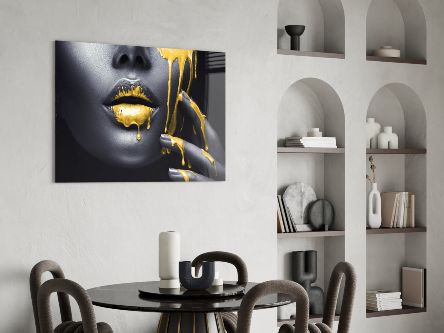 Yellow Lips Glass Wall Art displayed above black round dining table in modern interior with built-in shelving.