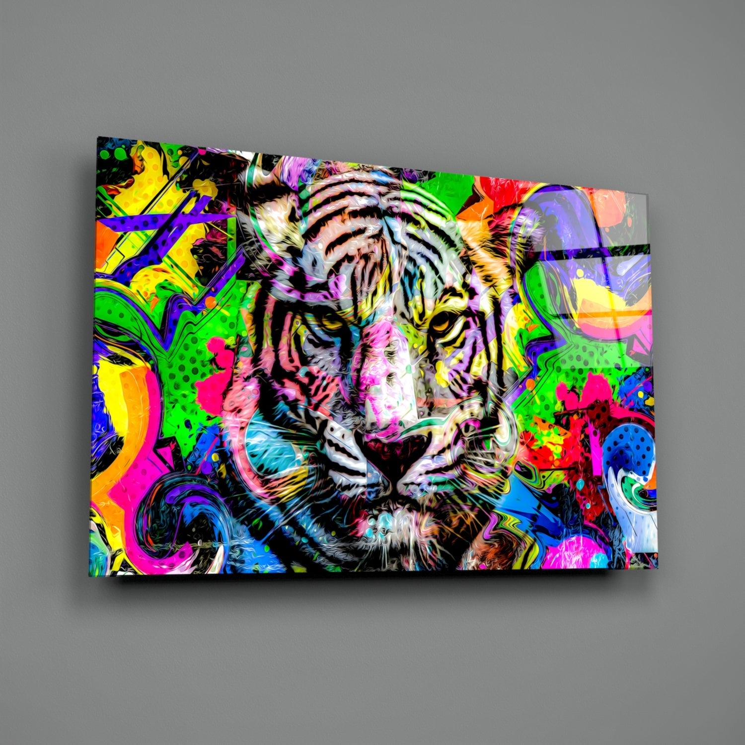 Colorful glass wall art featuring a vibrant tiger's face with neon pink, yellow, green, and blue abstract patterns on gray background.