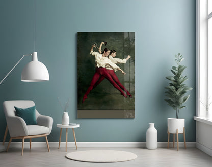Fencing glass wall art depicting two fencers in cream shirts and red pants mid-duel against dark background, displayed in modern room setting.