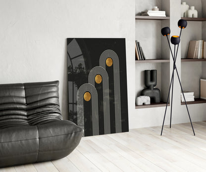 Modern living room interior displaying Three Dots Glass Wall Art with white lines and gold circles on black canvas, leaning against wall.