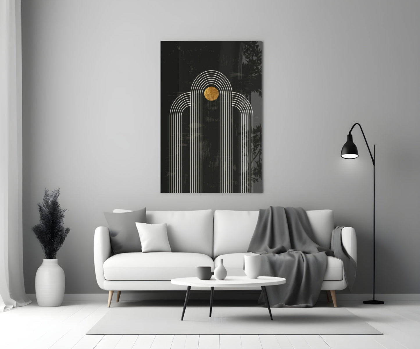 Modern living room styled with white sofa displaying black glass wall art featuring white concentric arches and gold circle detail above.