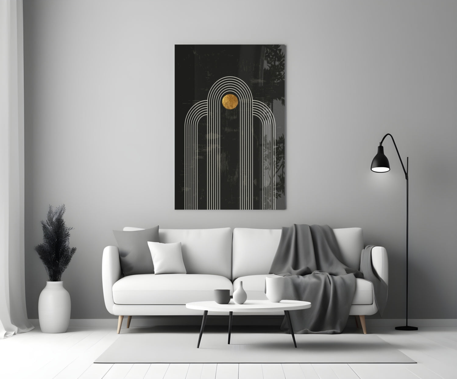 Modern living room styled with white sofa displaying black glass wall art featuring white concentric arches and gold circle detail above.