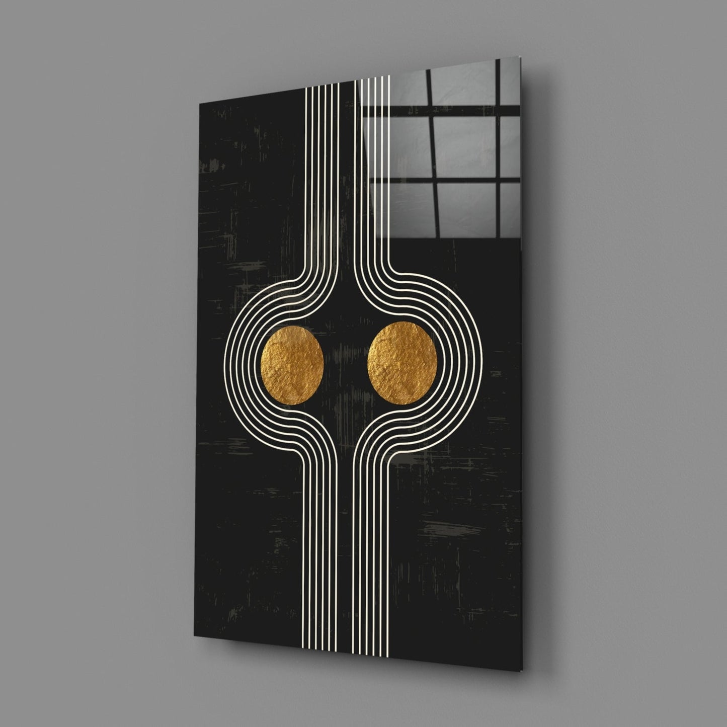 Black glass wall art with white geometric line patterns and two gold circular accents, displayed at an angle against gray background.
