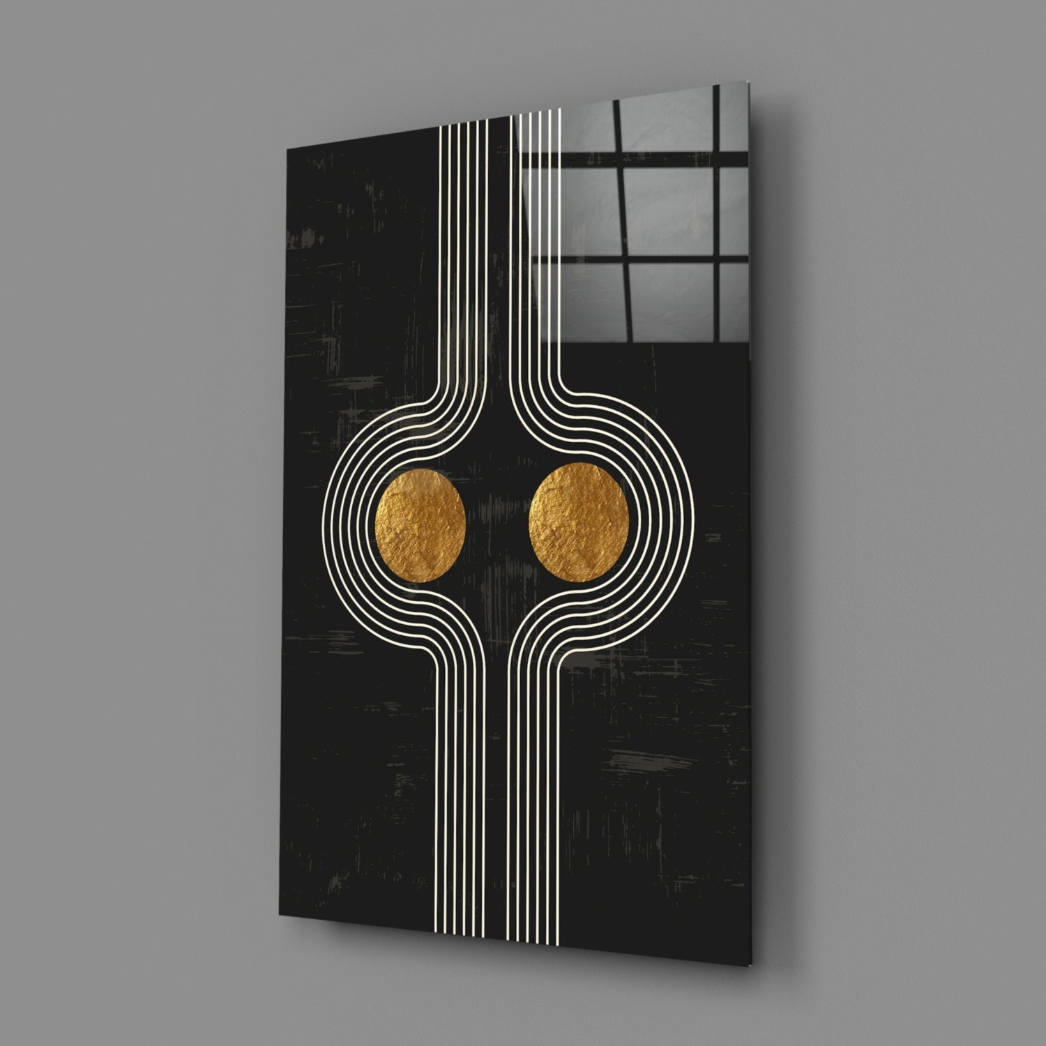 Black glass wall art with white geometric line patterns and two gold circular accents, displayed at an angle against gray background.