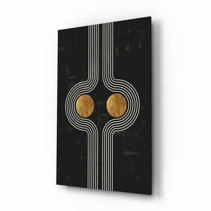 Modern glass wall art with symmetrical white linear design and two gold circular elements on black textured background, angled perspective view.