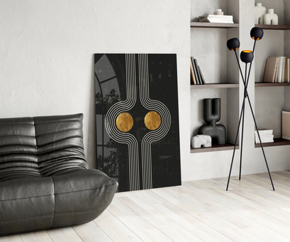 Modern living room interior displaying Two Dots Glass Wall Art with black and gold geometric design leaning against white wall.