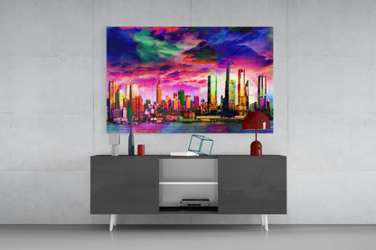 Vibrant neon cityscape glass art hanging above gray media console with red lamp and decorative accessories.