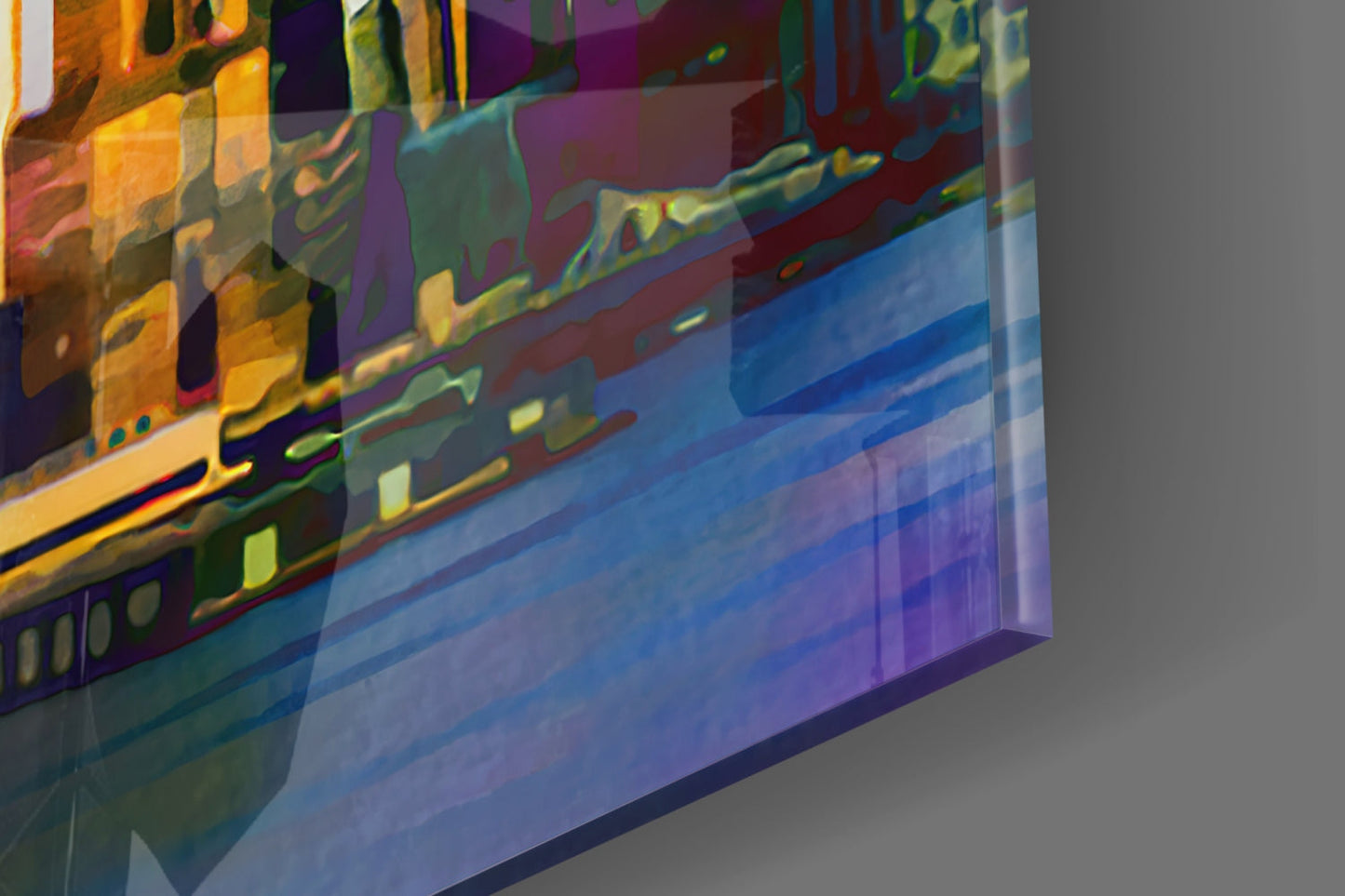Angled close-up of translucent glass wall art displaying colorful layered city silhouettes in yellow, blue, purple, and green hues.
