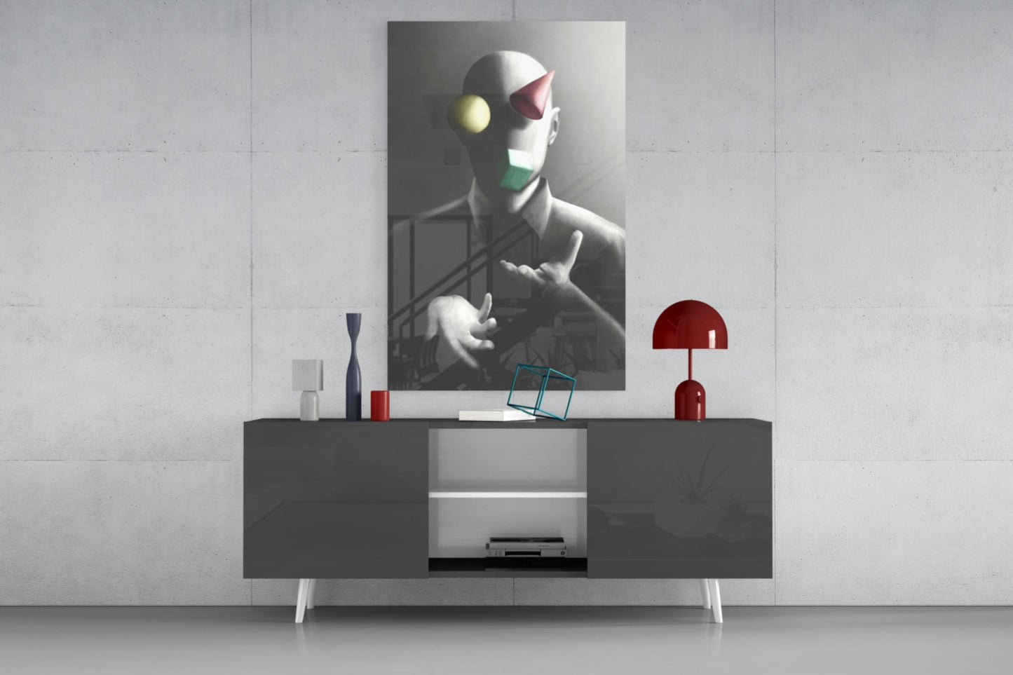 Juggler Glass Wall Art displayed above a dark console table with red lamp and decorative objects in a modern interior setting.