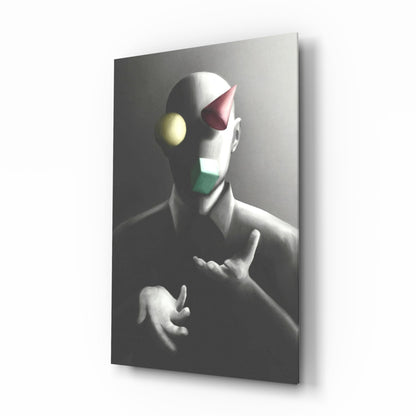 Three-dimensional glass wall art depicting a stylized figure juggling colored spheres in yellow, pink, and green against a dark background.