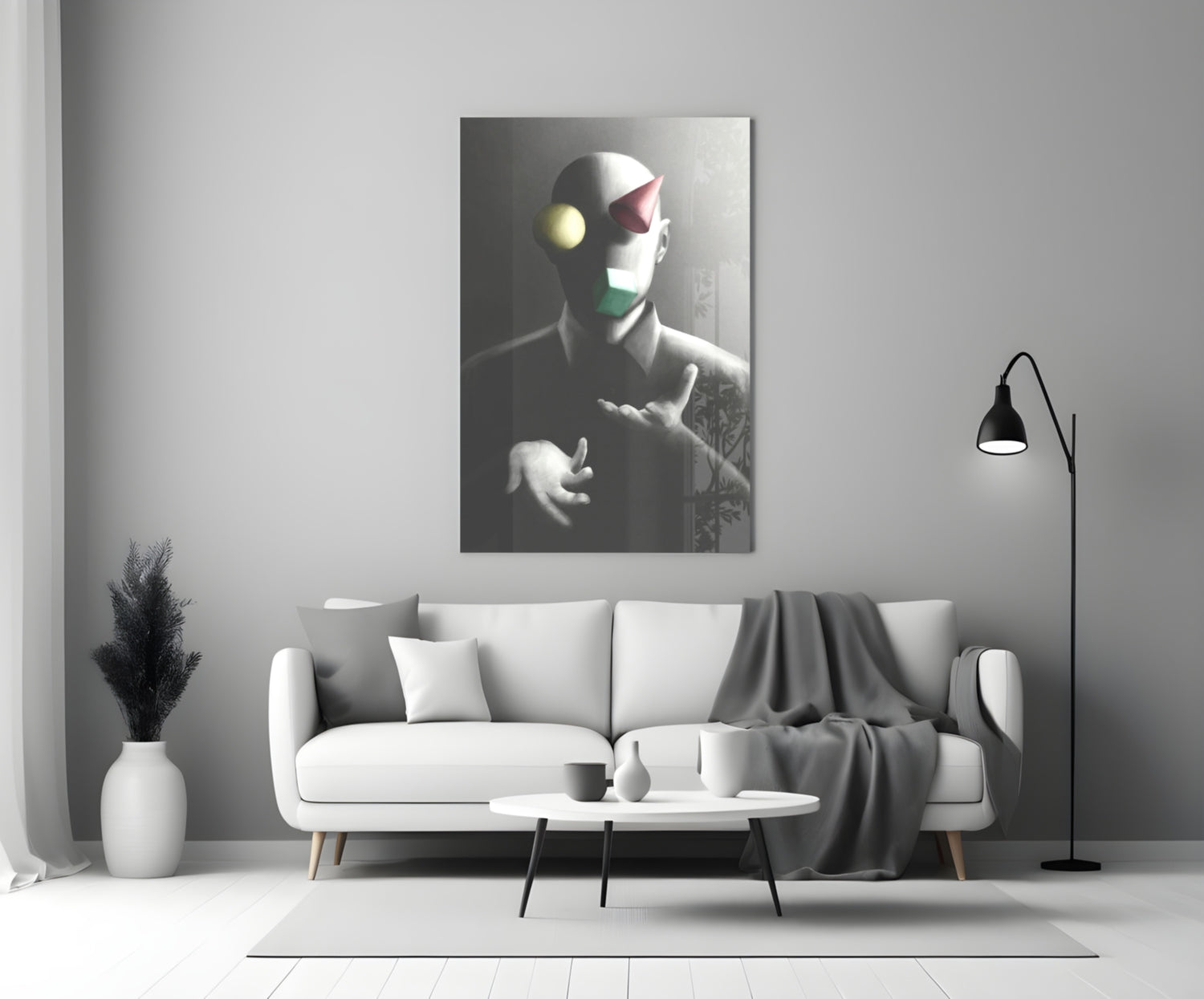 Juggler Glass Wall Art displayed above a white sofa in a minimalist living room setting with monochromatic decor.