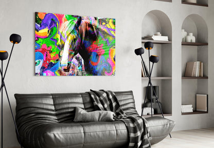 Vibrant multicolored horse glass wall art hung above black leather sofa in modern living room with white shelving.