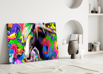 Vibrant multicolored horse glass art leaning against white wall in minimalist room setting with decorative objects.