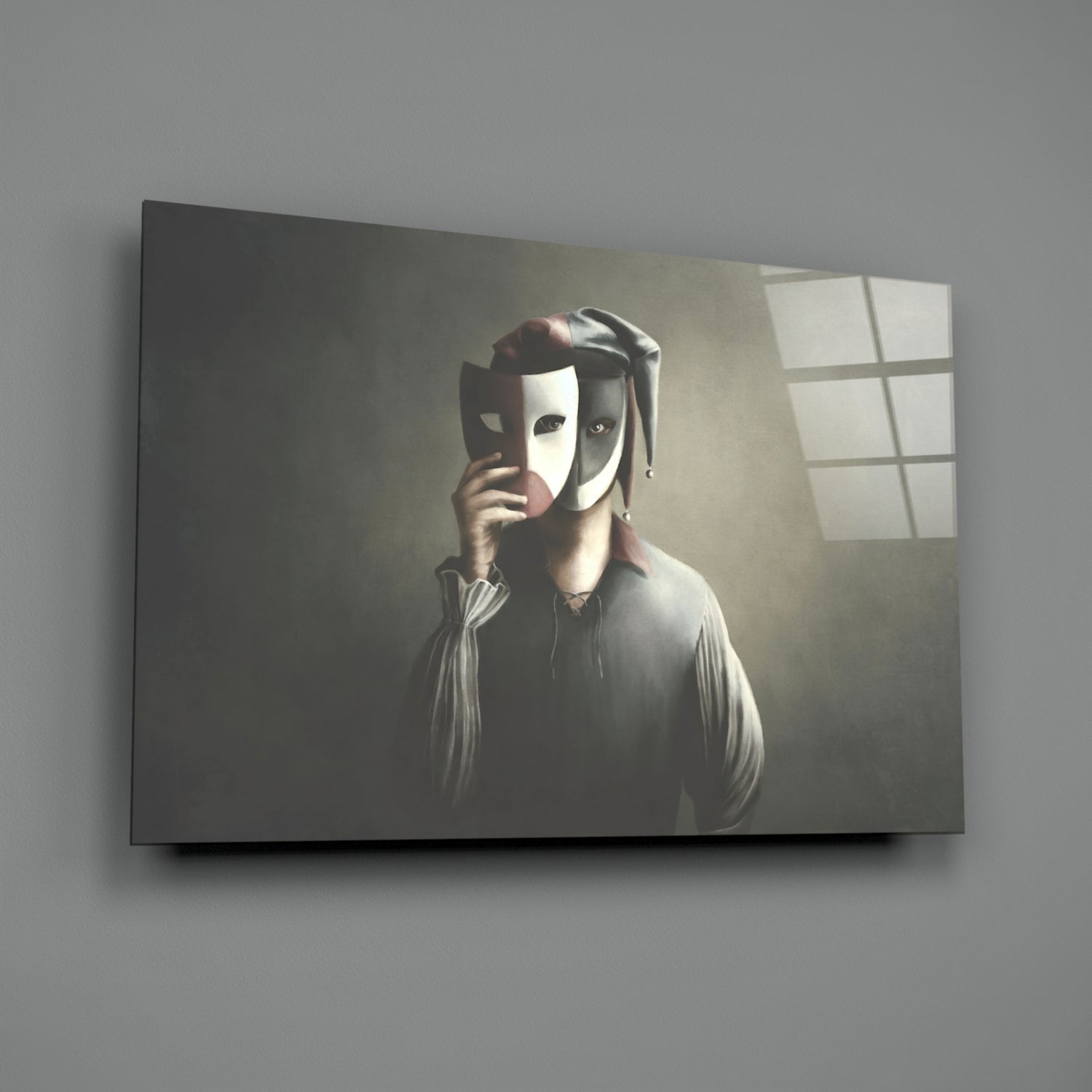 Figure in white shirt holding theatrical mask to face against grey wall with window, displayed on glass wall art panel.