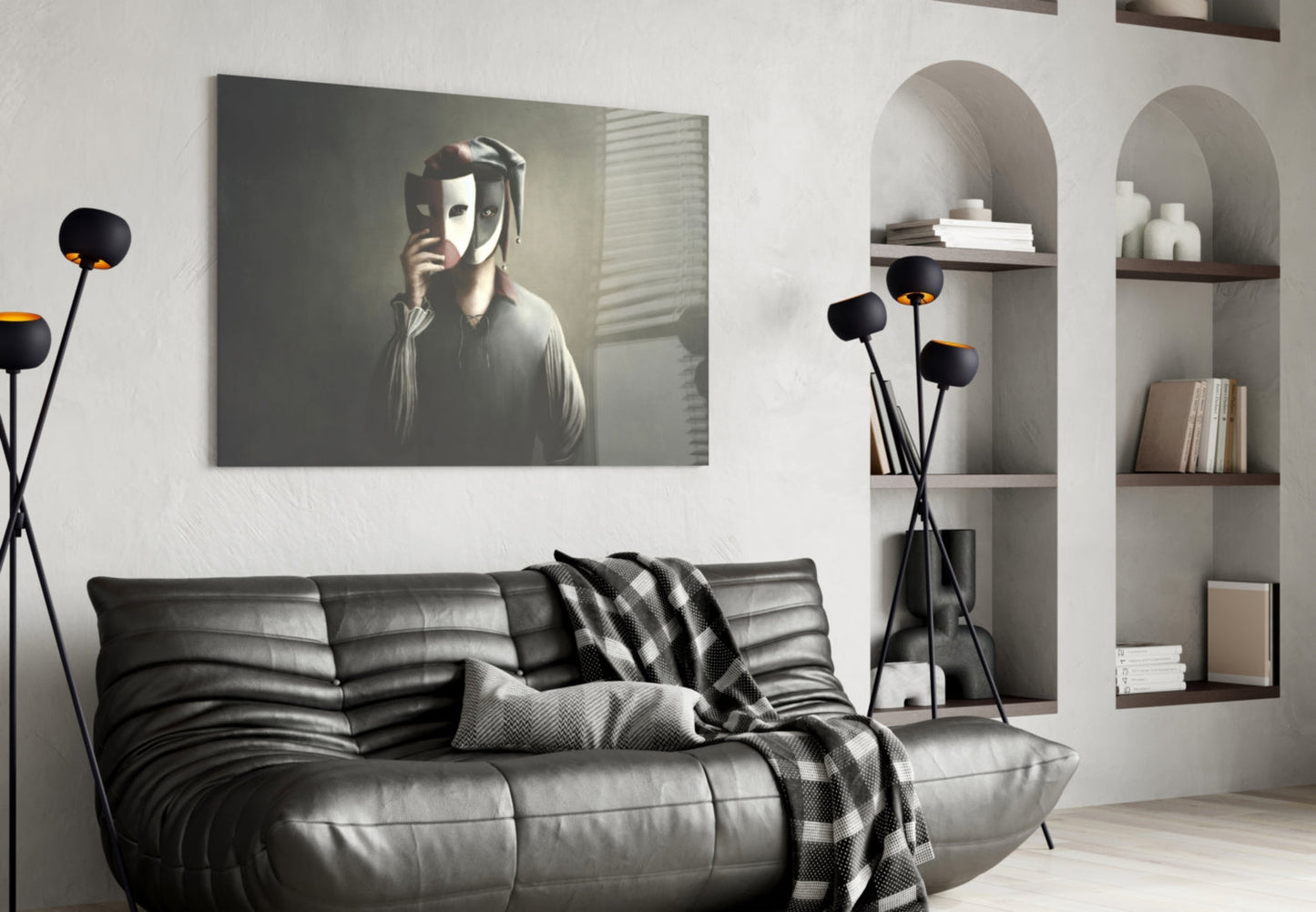 Masks Glass Wall Art displayed above black leather sofa in modern living room with arched shelving and decorative floor lamp.