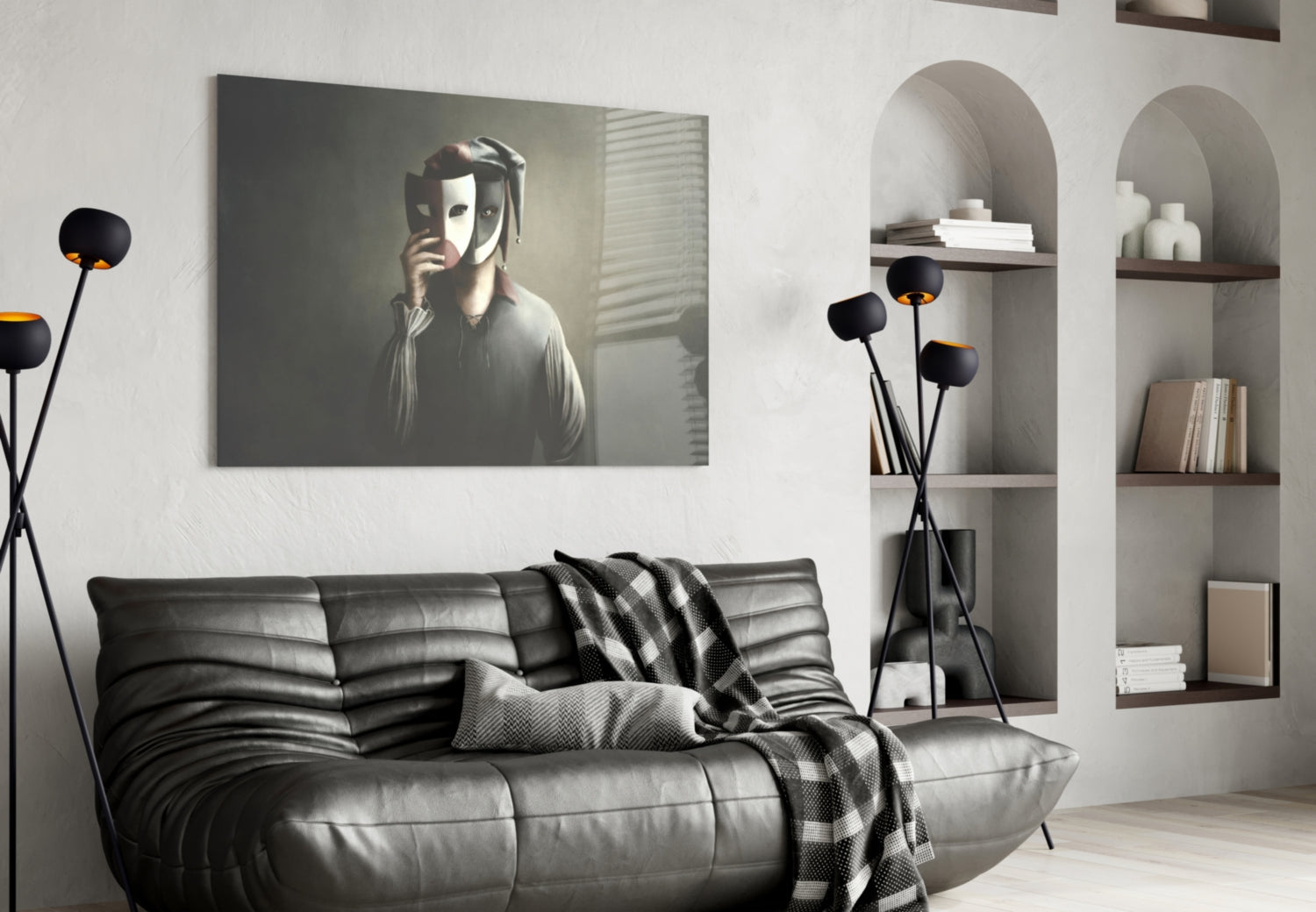 Masks Glass Wall Art displayed above black leather sofa in modern living room with arched shelving and decorative floor lamp.
