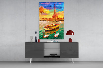 Colorful glass wall art depicting the Eiffel Tower, boat, and swans displayed above a dark console table in a modern interior setting.