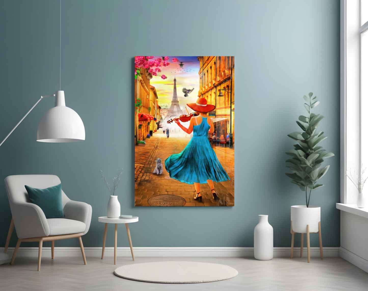Colorful glass wall art depicting a woman in blue dress playing violin on a Paris street with Eiffel Tower, displayed in a modern living room with teal walls.