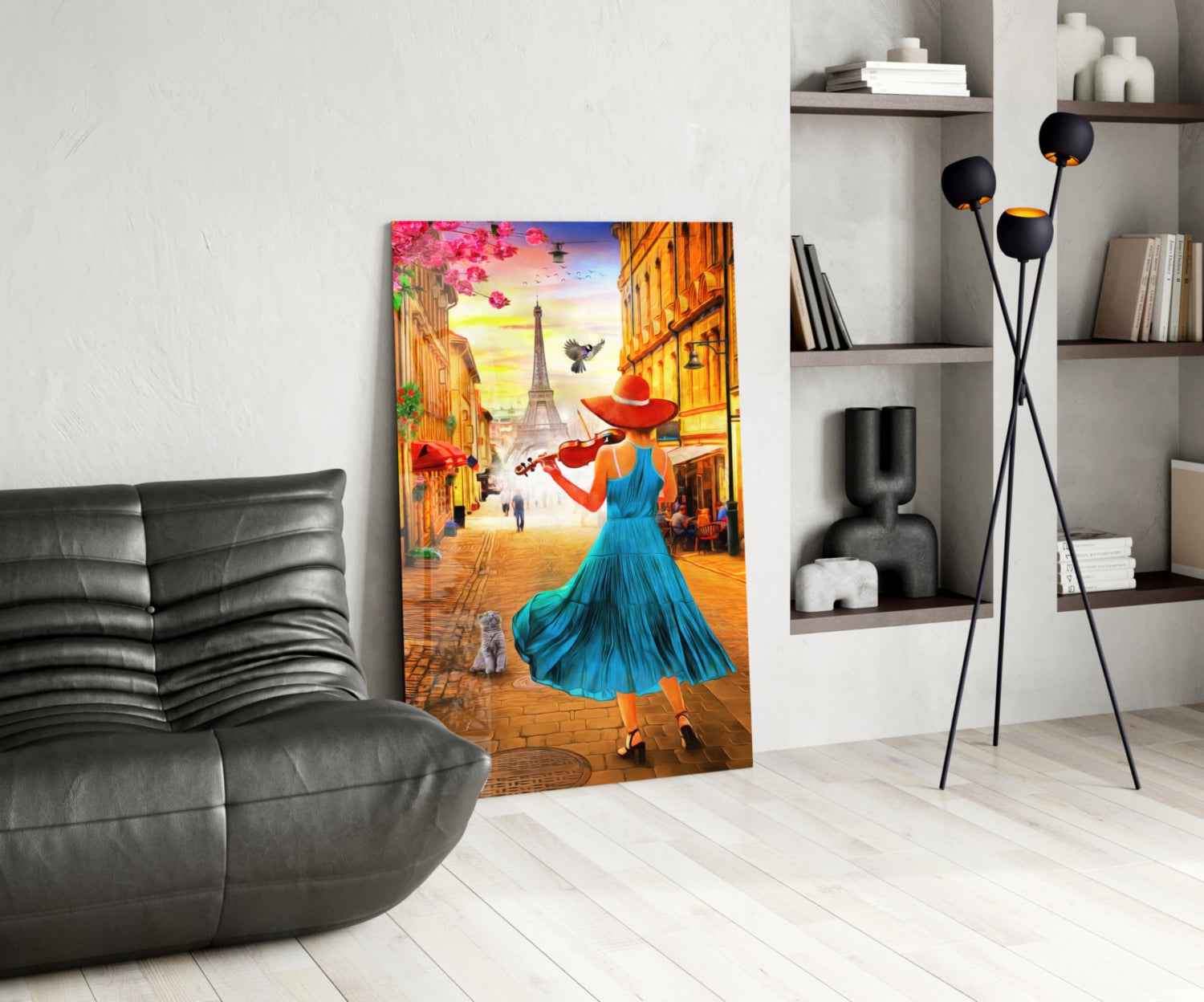 Vibrant glass wall art depicting a woman in blue dress with violin on a Paris street with Eiffel Tower, displayed in modern living room setting.
