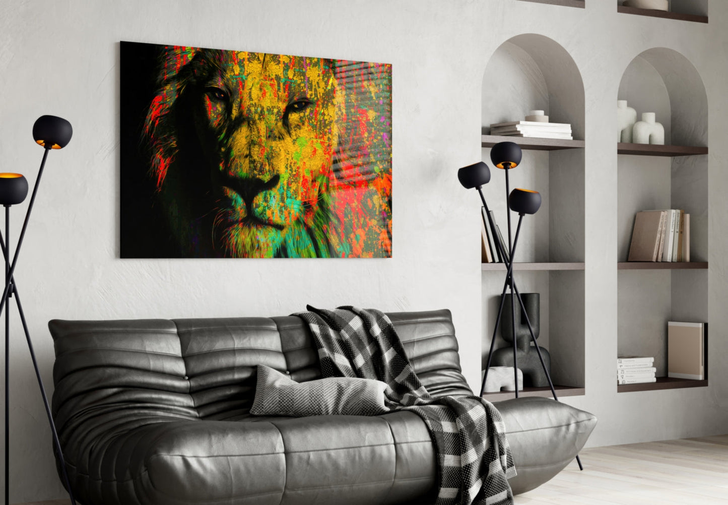 Colorful lion face glass wall art in red, yellow, and green displayed above a gray leather sofa in a modern living room.