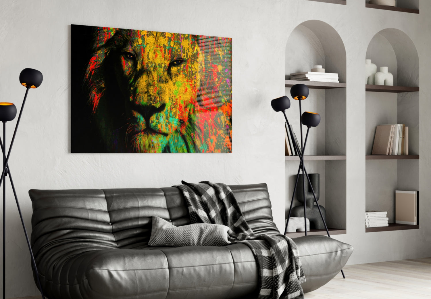 Colorful lion face glass wall art in red, yellow, and green displayed above a gray leather sofa in a modern living room.