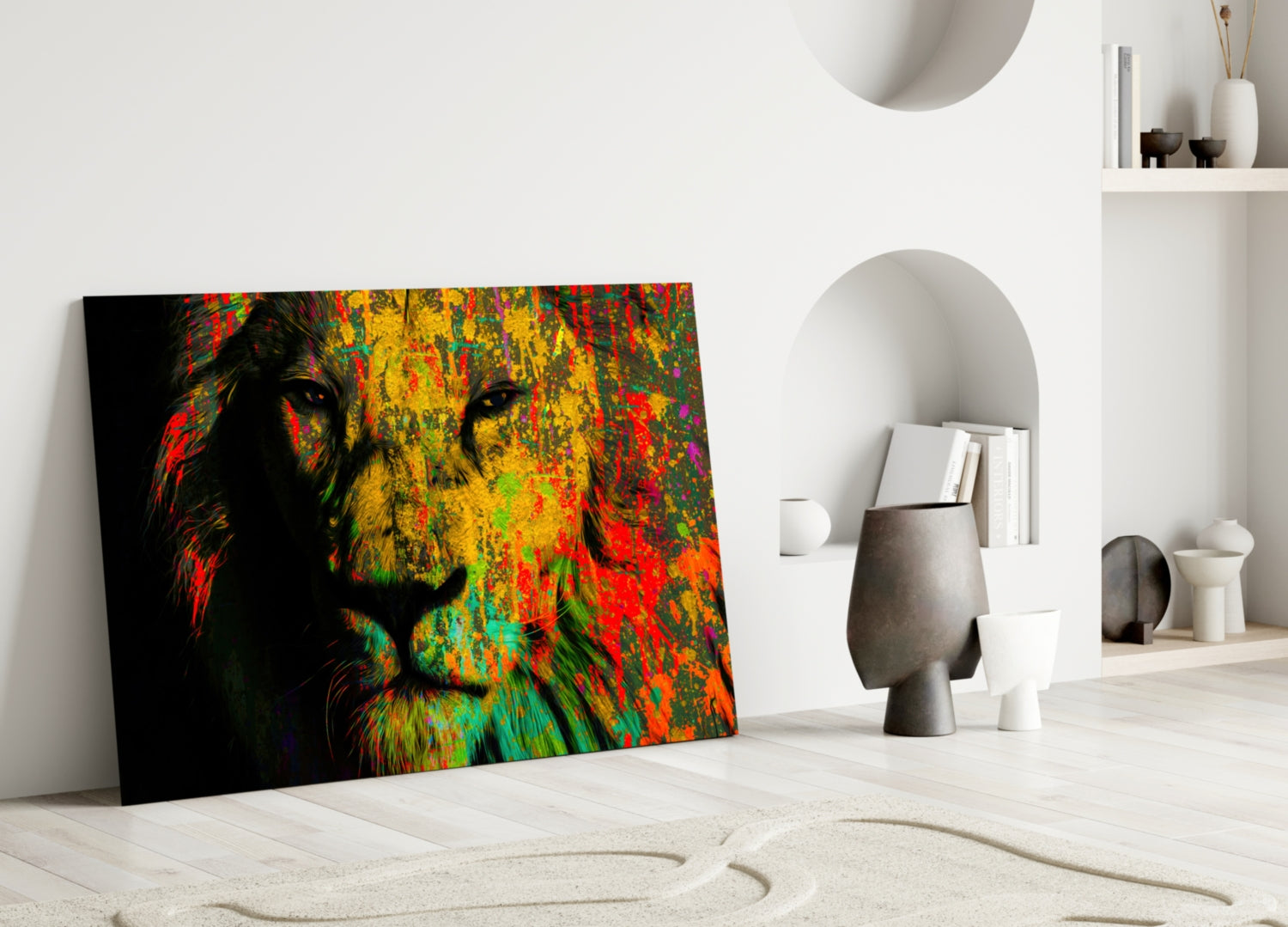 Colorful lion head glass wall art leaning against white wall in minimalist interior setting with decorative objects.