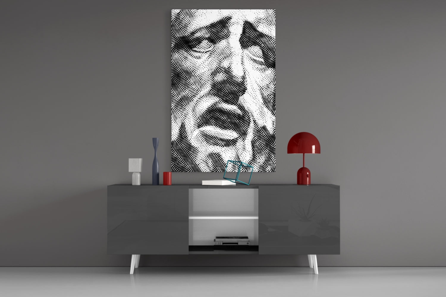 Black and white wavy striped glass wall art displayed above gray media console with red lamp and decorative objects.