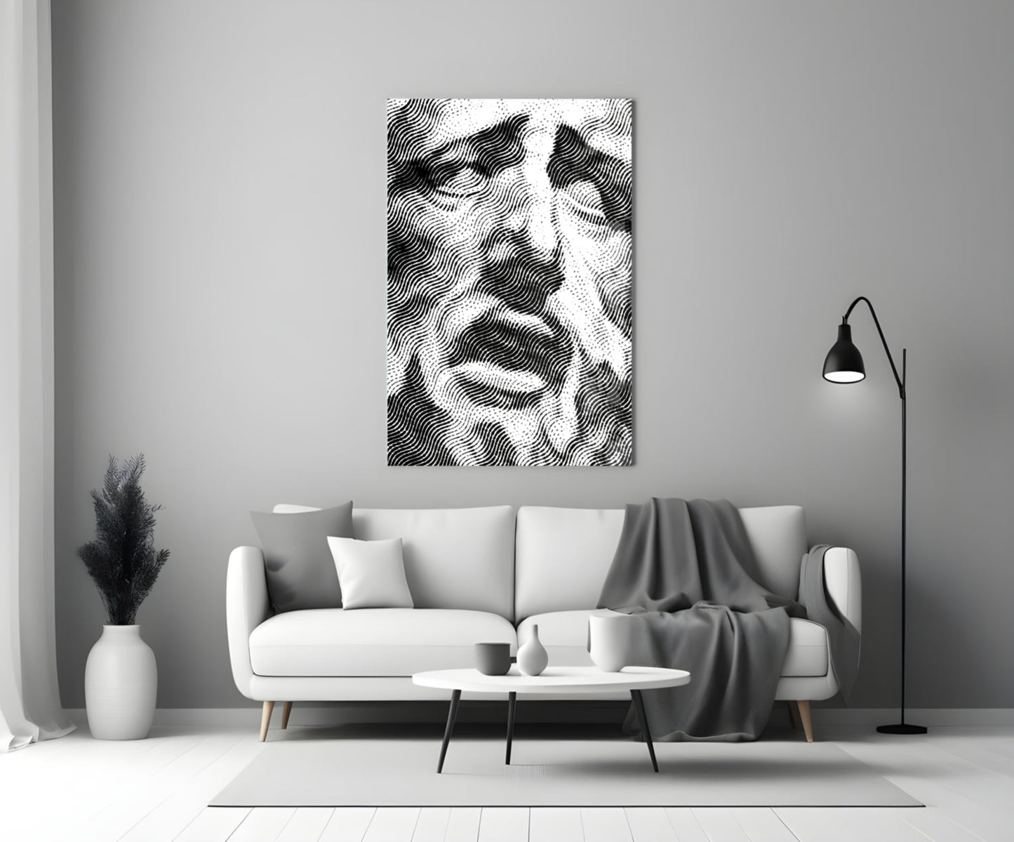 Black and white wavy striped glass art displayed above a white sofa in a minimalist living room interior.