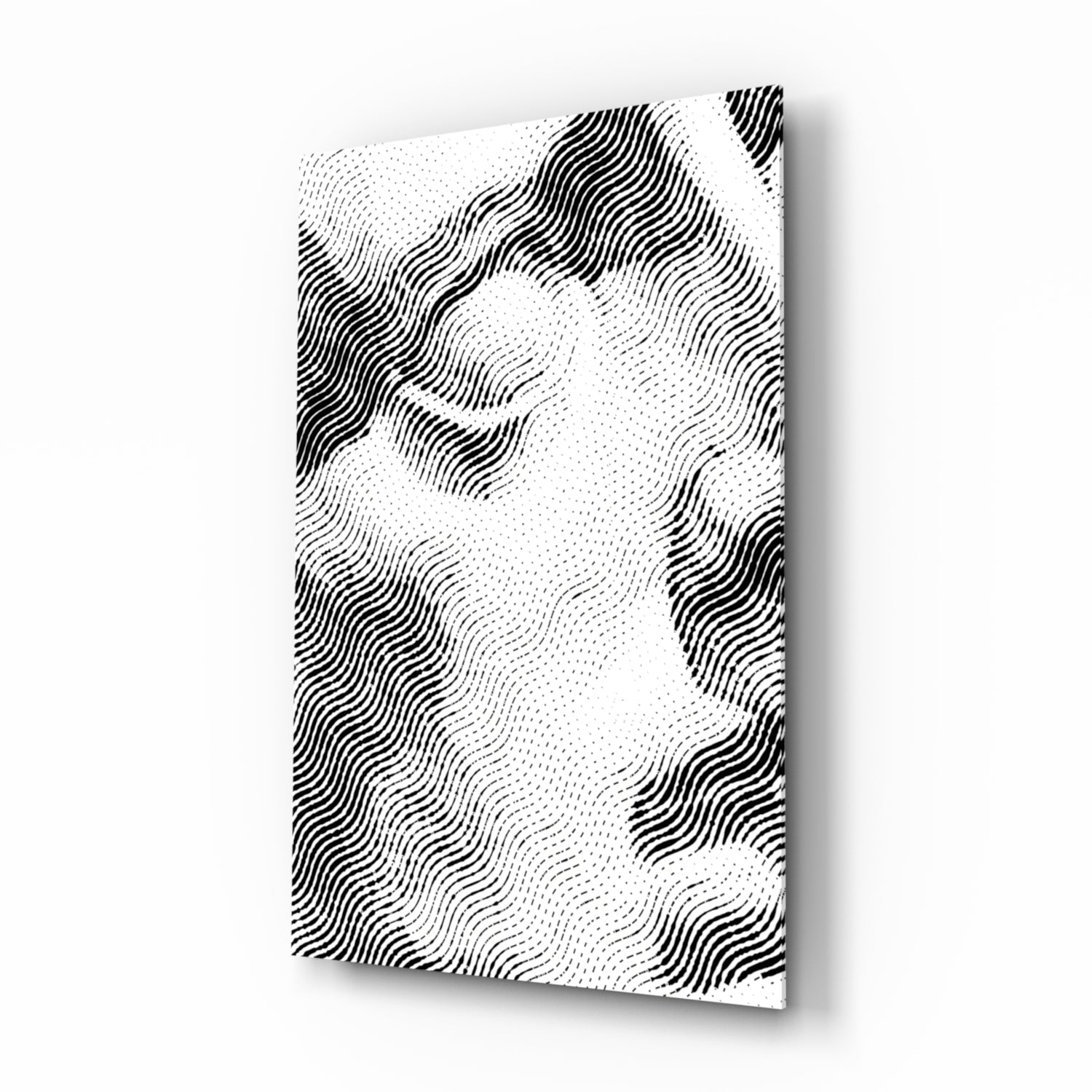 Angled view of white glass wall art panel with black wavy line patterns and dotted texture creating dimensional effect.