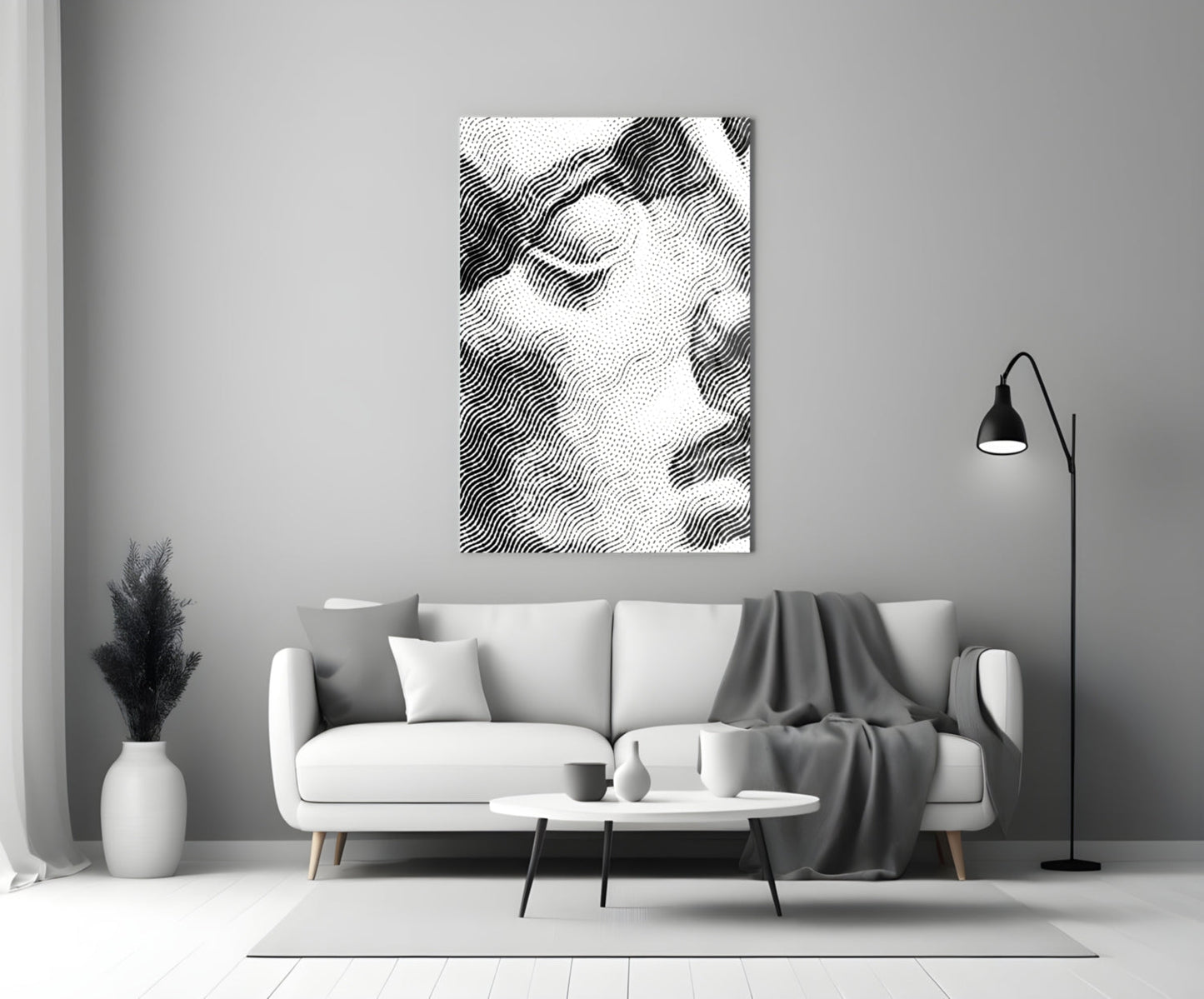 Black and white wavy line pattern glass wall art displayed above a white sofa in a minimalist living room setting.