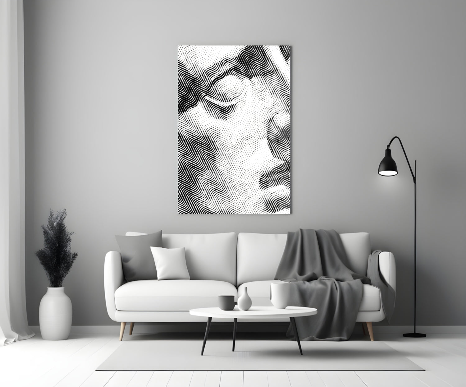 Black and white wavy line pattern glass wall art displayed above a white sofa in a minimalist living room setting.