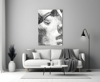 Black and white wavy line pattern glass wall art displayed above a white sofa in a minimalist living room setting.