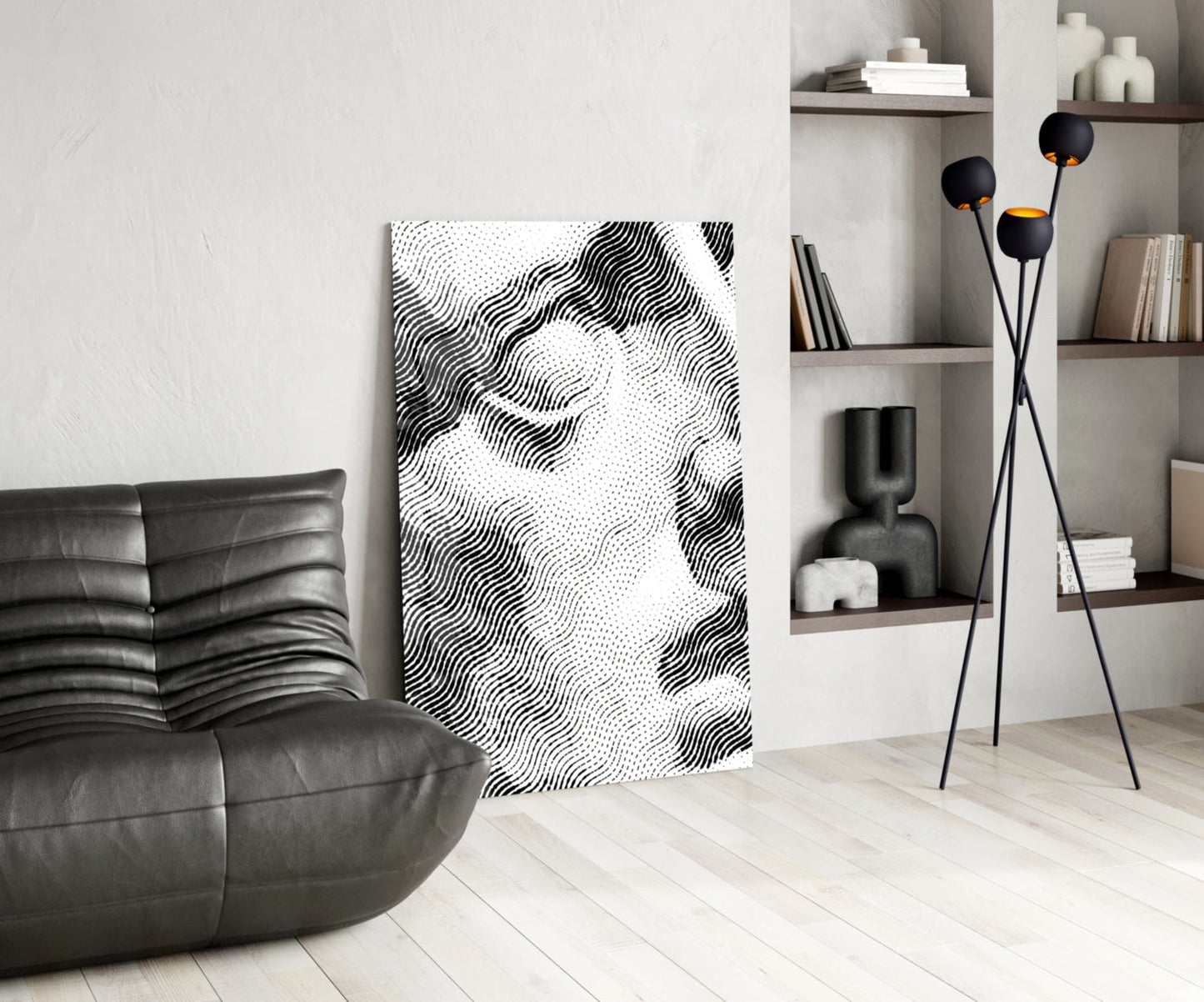 Black and white wavy line glass art panel displayed in minimalist living room with leather sofa and shelving.