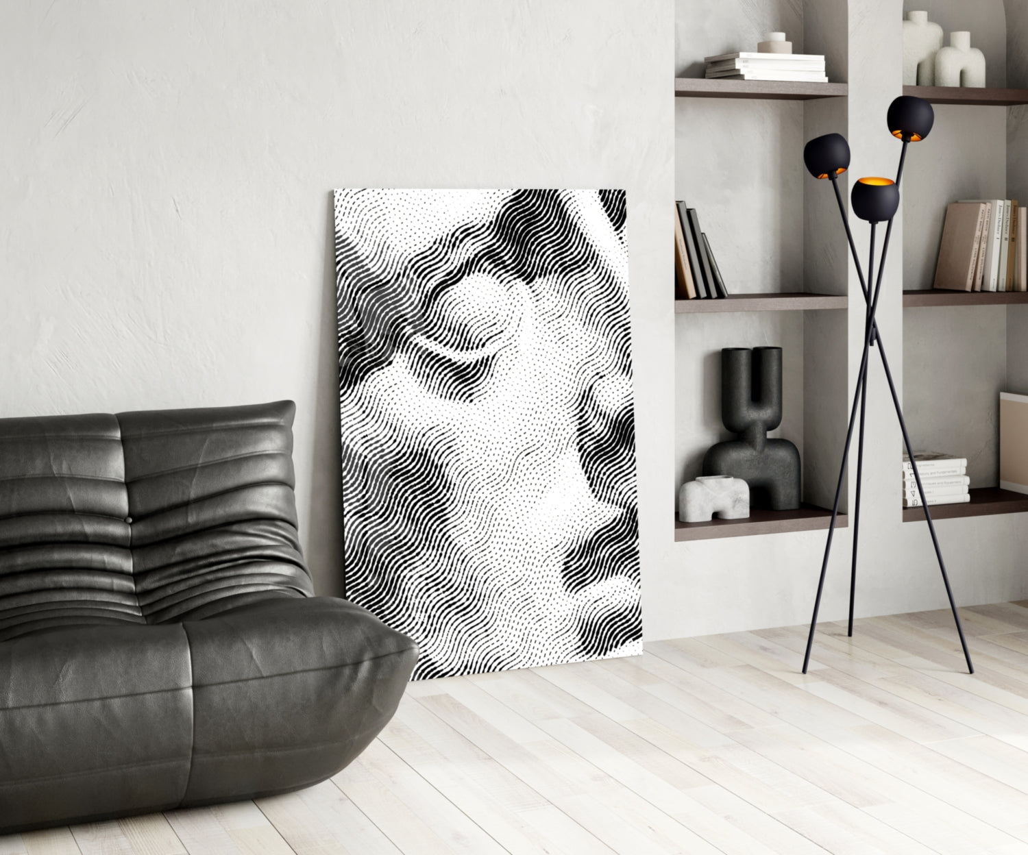 Black and white wavy line glass art panel displayed in minimalist living room with leather sofa and shelving.