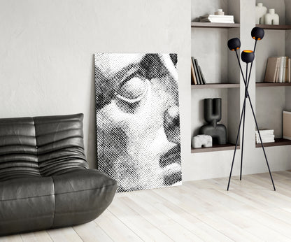 Black and white wavy line glass art panel displayed in minimalist living room with leather sofa and shelving.