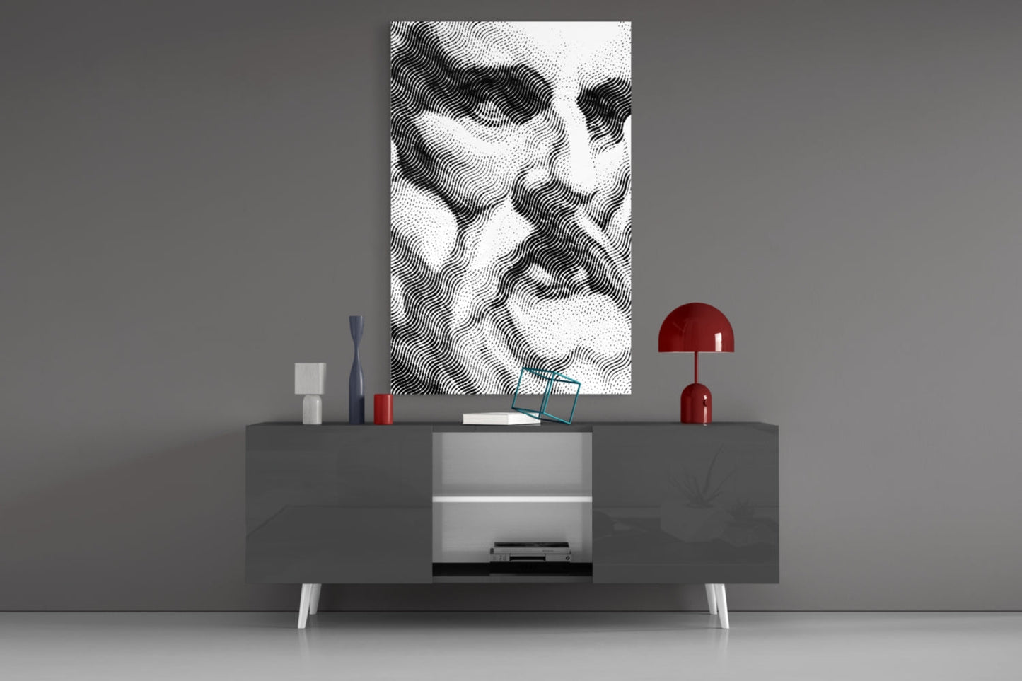 Black and white wavy line pattern glass art displayed above gray media console with red lamp and decorative accessories.