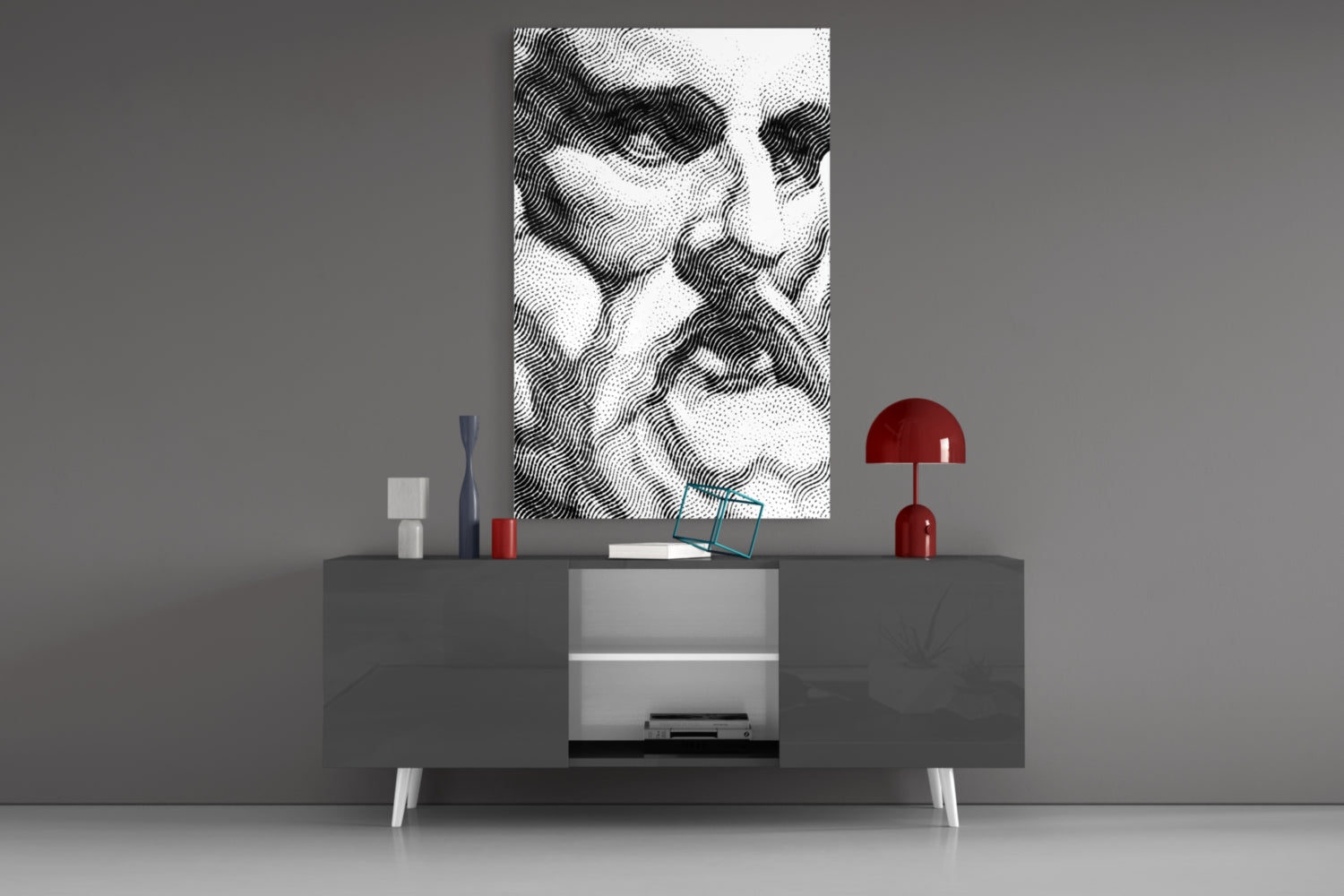 Black and white wavy line pattern glass art displayed above gray media console with red lamp and decorative accessories.