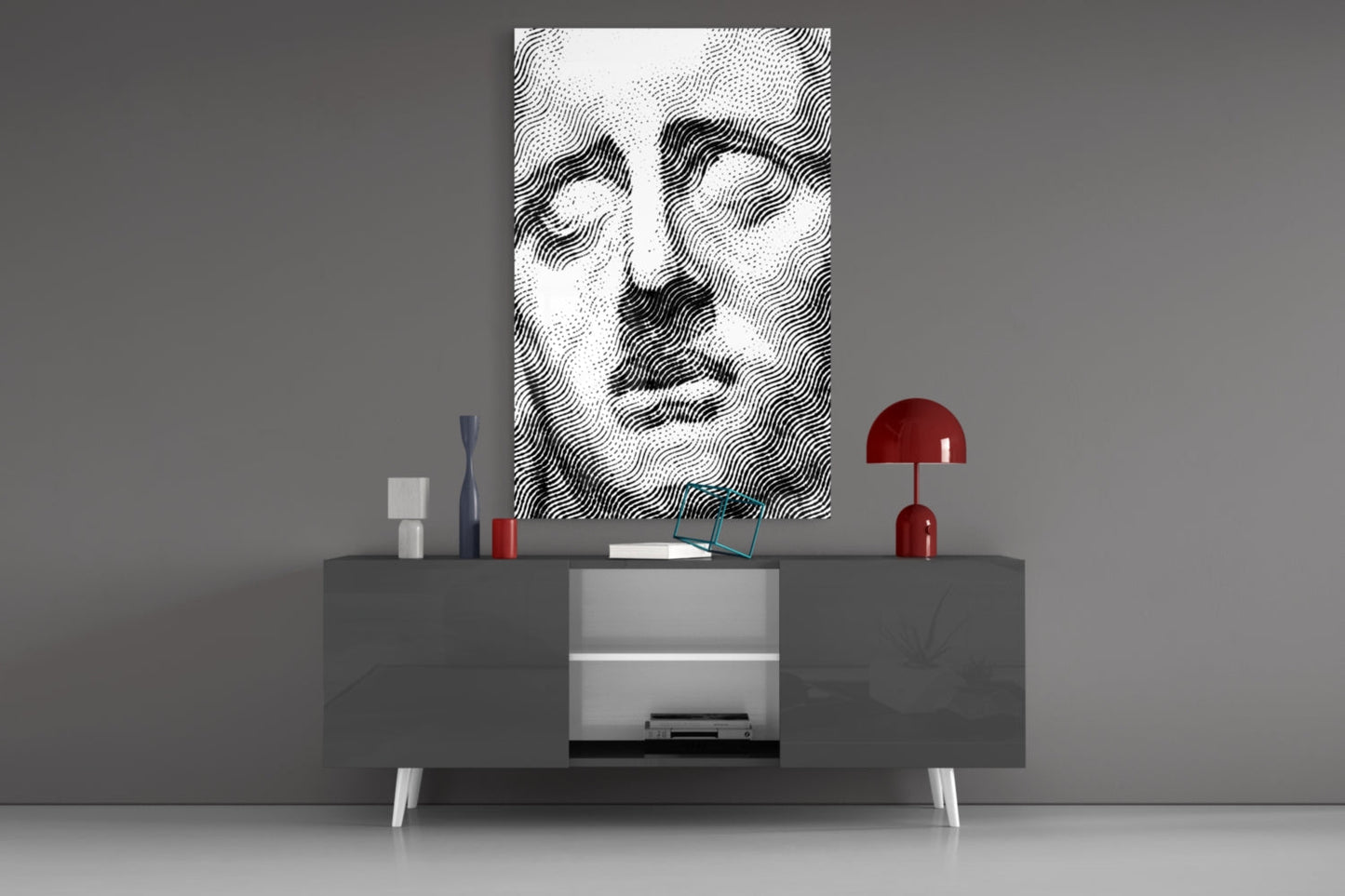 Abstract wavy line portrait in black and white displayed above gray media console with red lamp and decorative accessories.