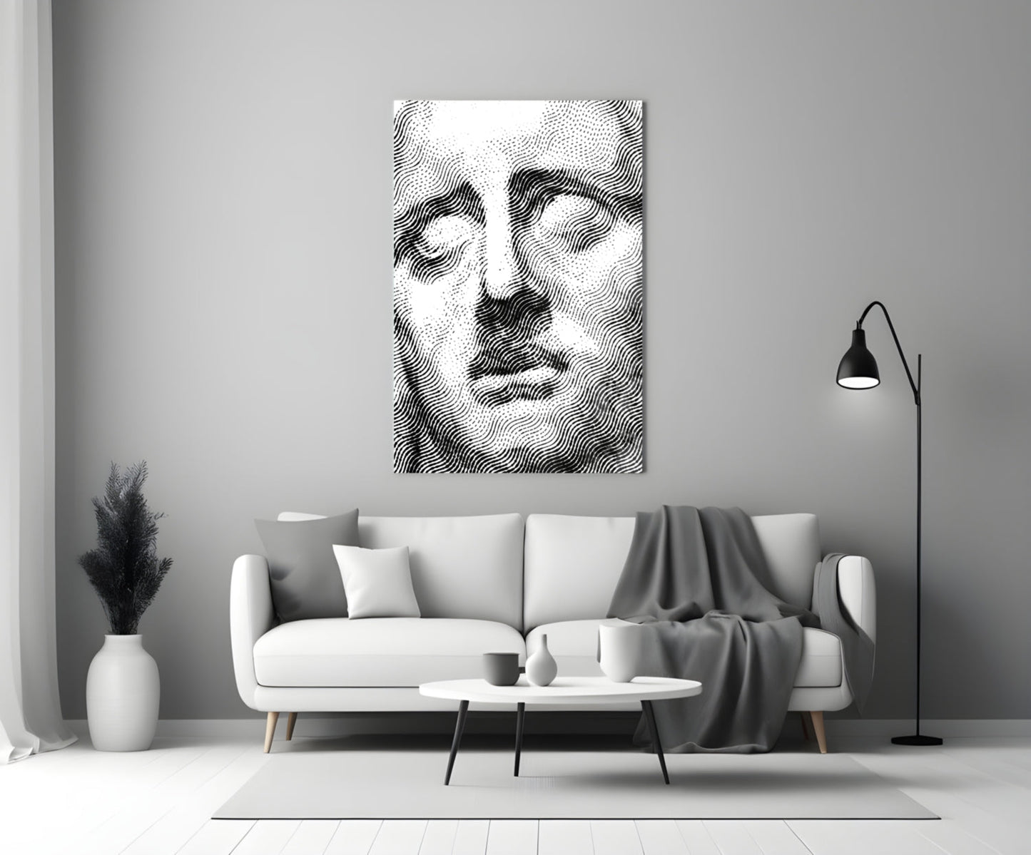 Black and white wavy line portrait art hanging above a white sofa in a minimalist living room interior.