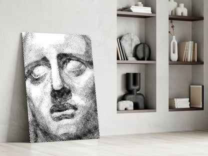 Black and white wavy line portrait artwork leaning against white wall beside open shelving with decorative objects.