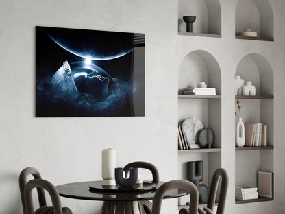 Astronaut's Look Glass Wall Art displayed above a black round dining table with upholstered chairs, showing Earth and spacecraft in blue light against dark space.