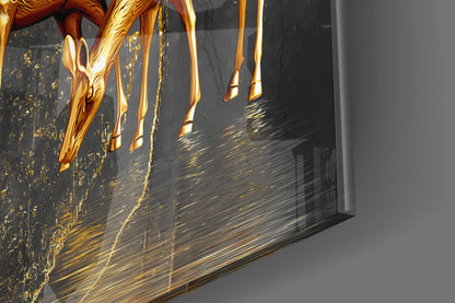 Close-up side view of golden gazelle legs and tree details with gold leaf effects on dark glass panel.