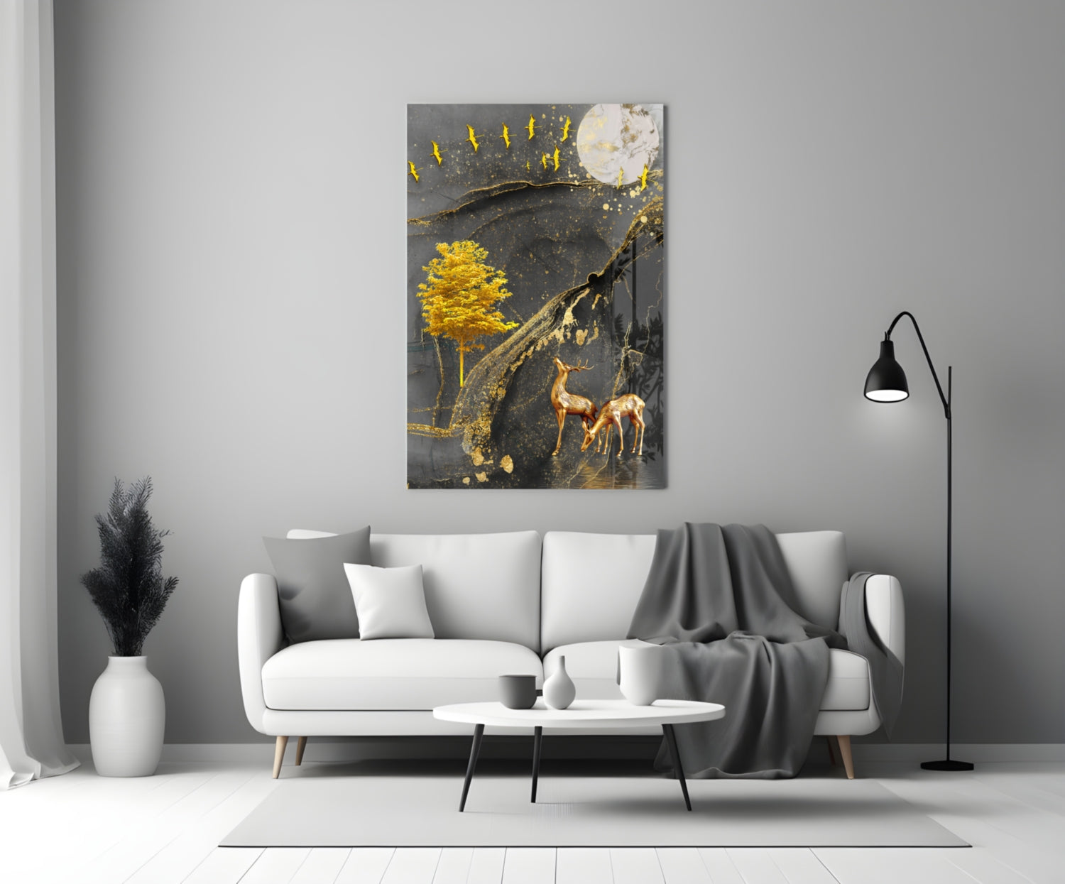 Golden Tree and Gazelles glass wall art displayed above white sofa in minimalist living room setting.