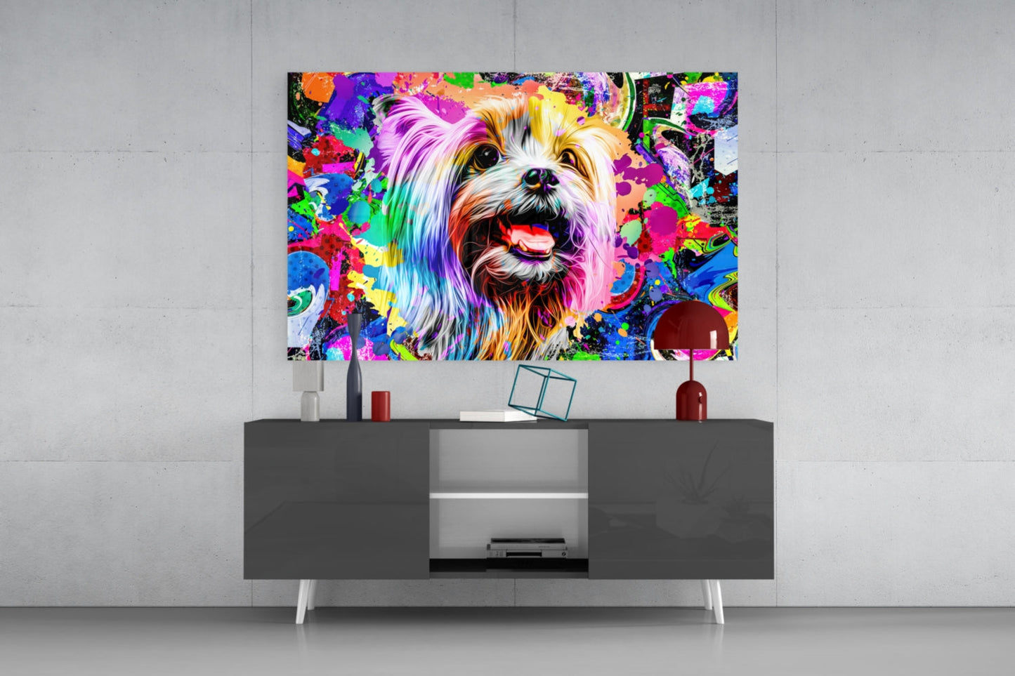 Colorful glass wall art of a smiling dog with rainbow fur displayed above a dark media console in a modern interior setting.