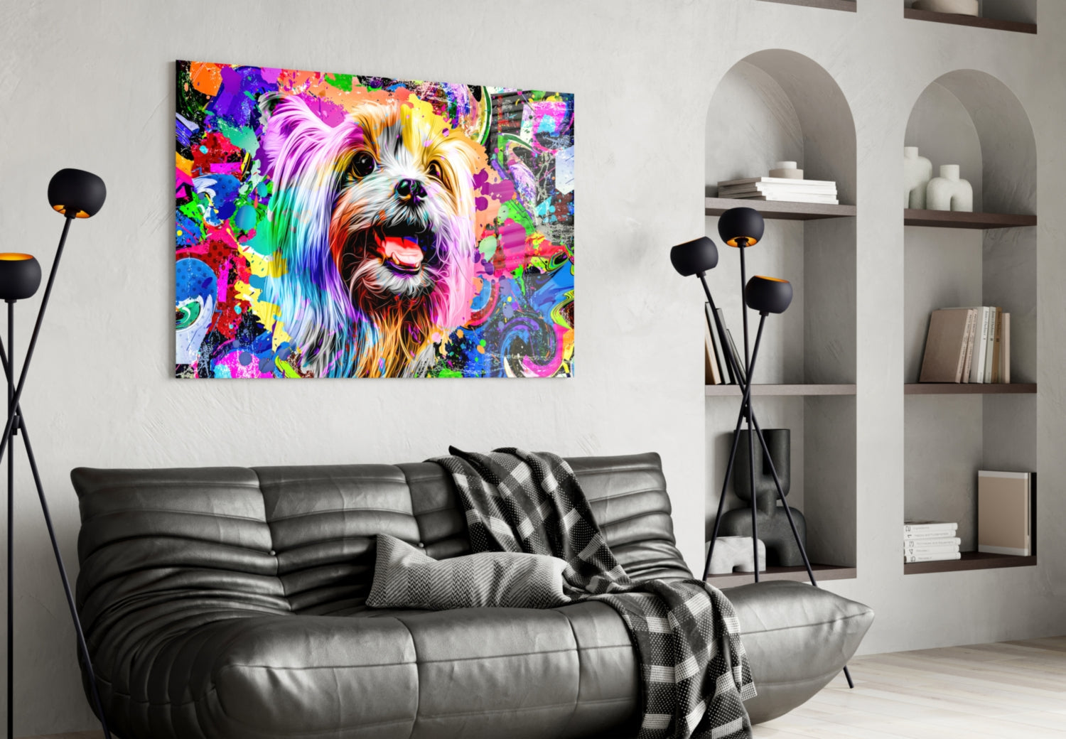 Colorful pop art glass wall art of a smiling dog with rainbow brushstrokes displayed above a black leather sofa in a modern living room.