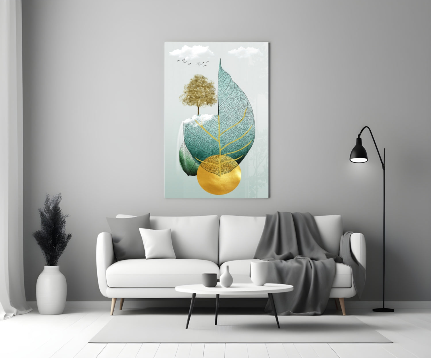 Tree on a Leaf Glass Wall Art displayed above a white sofa in a minimalist living room with gray accents.