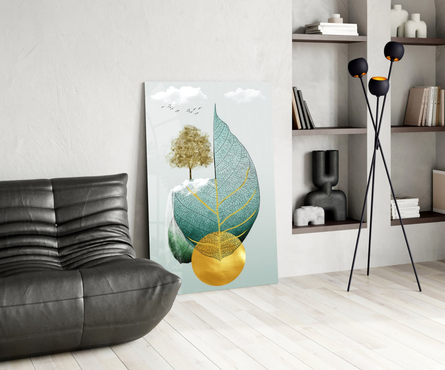 Modern living room displaying Tree on Leaf glass wall art leaning against wall, featuring golden tree, teal leaf with yellow veins, and yellow sphere.