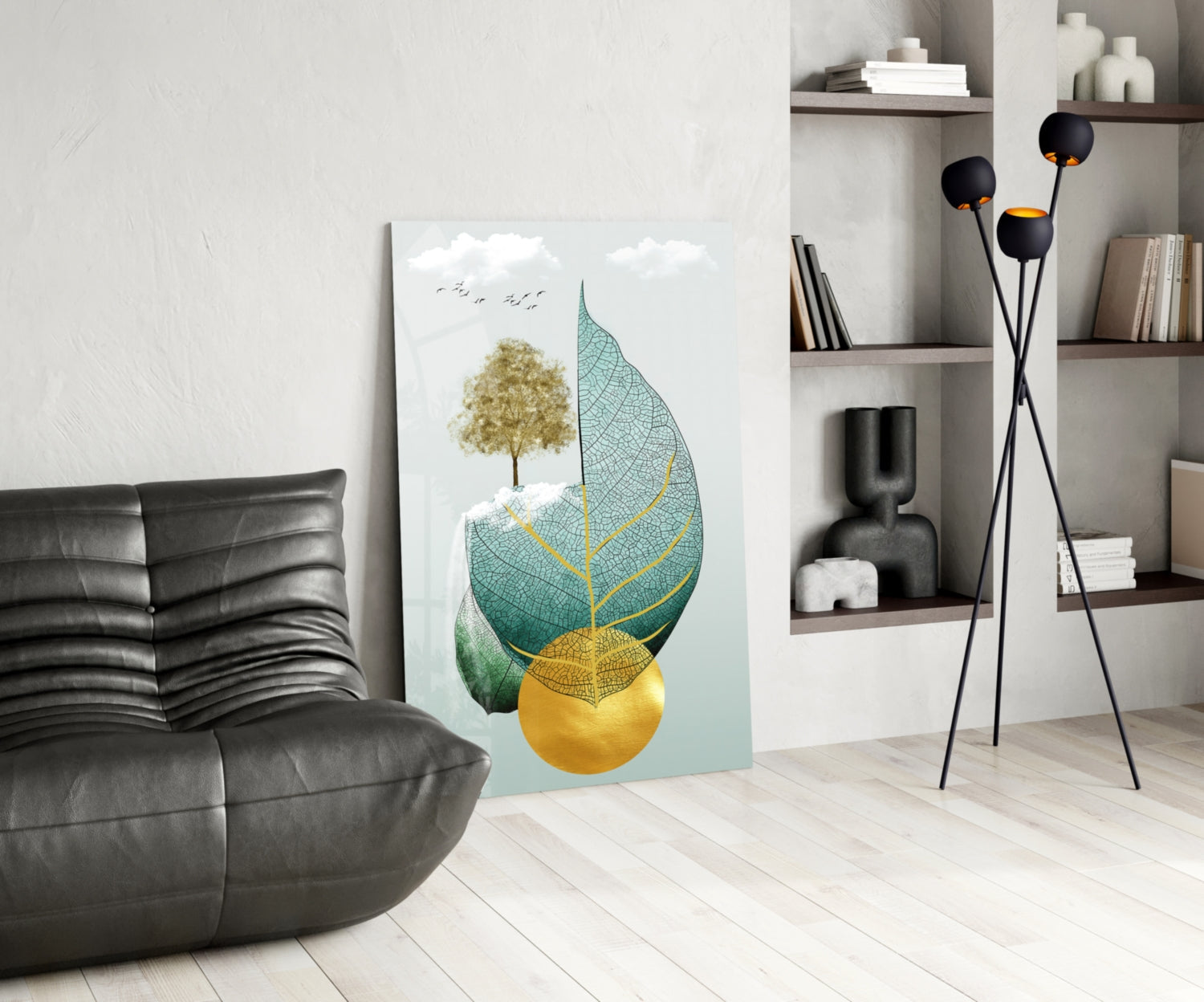 Modern living room displaying Tree on Leaf glass wall art leaning against wall, featuring golden tree, teal leaf with yellow veins, and yellow sphere.