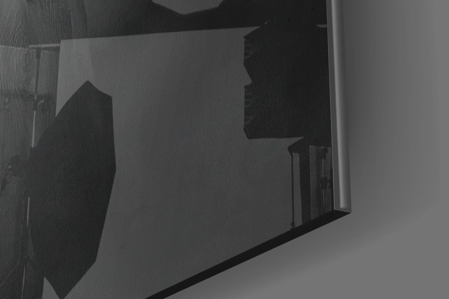Close-up angled view of translucent glass wall art panel showing silhouetted yellow hat design against frosted glass surface.